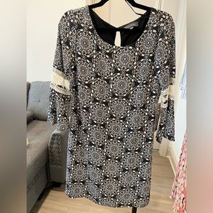 Cute new dress with tags.  Detailed sleeves.